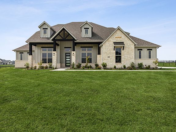 Exterior of a modern Texas ranch style home by Kindred Homes