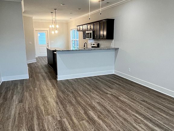 Open floor concept with luxury vinyl plank flooring.
