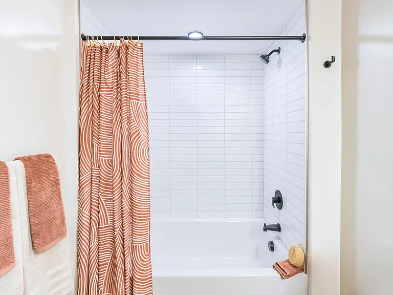 Spa-inspired bathrooms offer clean tile finishes, sleek fixtures, and a serene space to refresh and unwind.