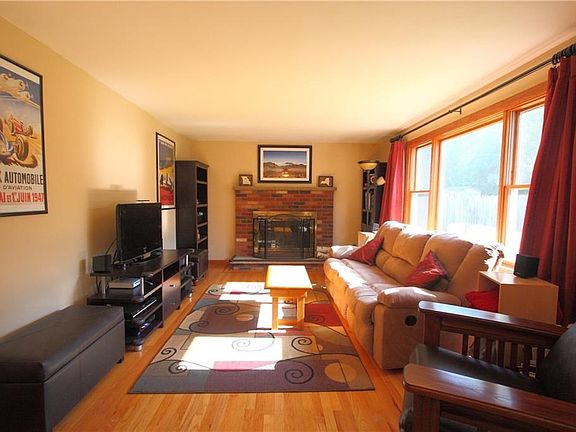 Wood burning fireplace, hardwood floors, plenty of sunlight!