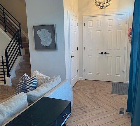 Large coat closet and half bathroom by the front door.