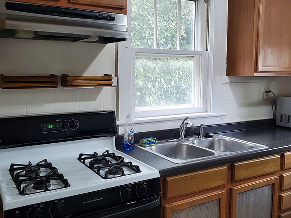 Spacious kitchen with Refrigerator, Stove and Microwave