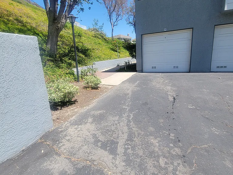 1 car garage and 1 car assigned parking in front of garage off street.