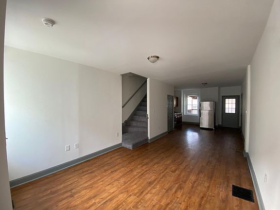 Living room open concept into dining room and kitchen