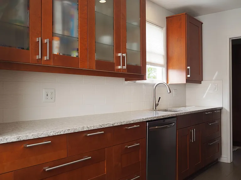 Updated kitchen with abundant storage, quartz counters, and stainless steel appliances