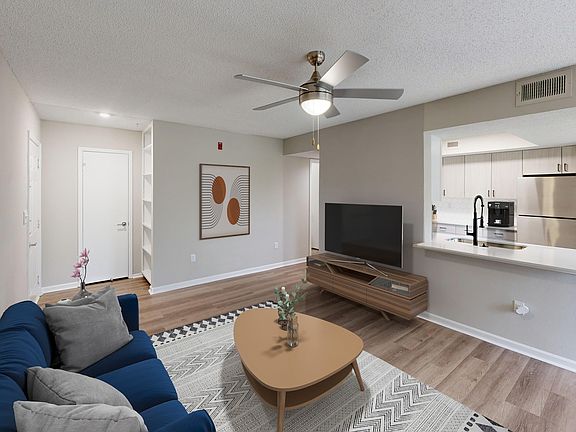 Newly Renovated Living Room wiith Gorgeous Hardwood-Style Flooring