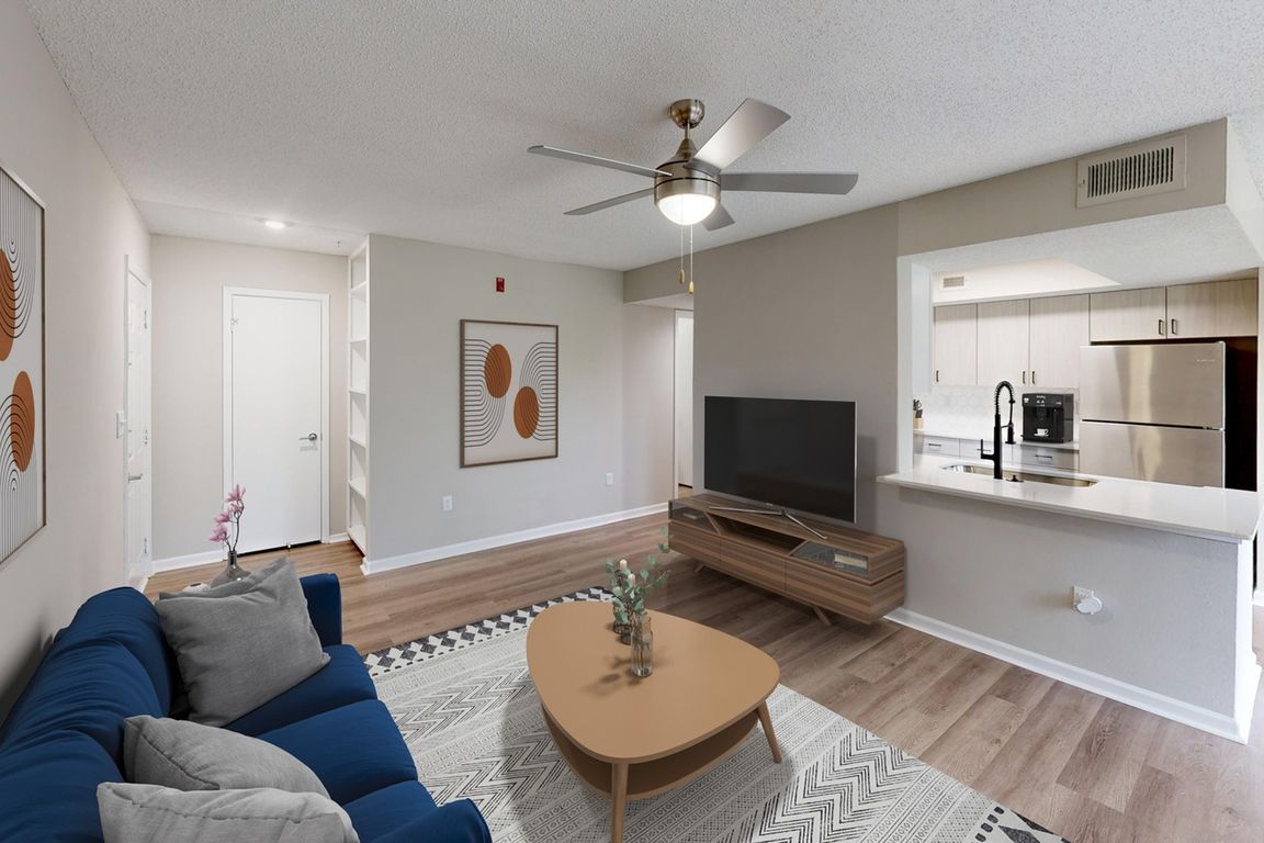 Newly Renovated Living Room wiith Gorgeous Hardwood-Style Flooring