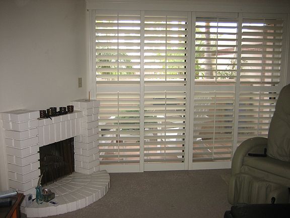 Brick electric fireplace, plantation shudders
