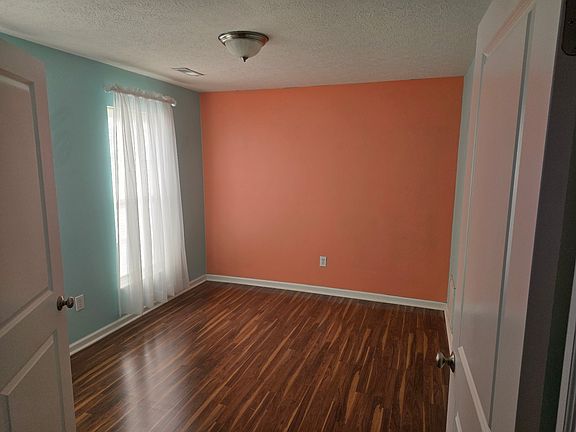 Extra room/office space on ground level between front door and garage.