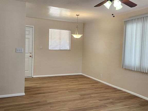Dining Room - View from living Living Room/Dining Room Combo with the Kitchen to the left, 
rear door to covered patio, laundry closet and back yard, window view of back yard,