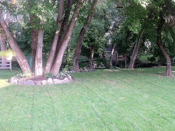 Grass area outside of Lower Level front door. Overlooks Baer Creek.