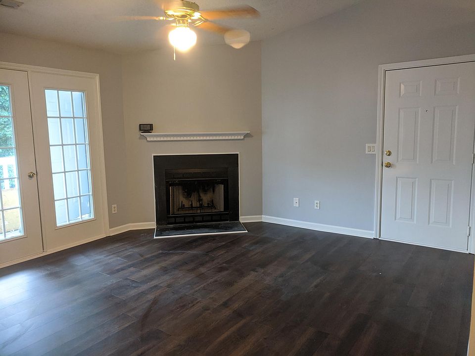 Living room, front entry and exit to balcony