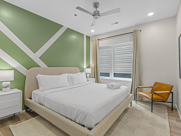 Main bedroom with walkin closet and private bath. staged similar unit. This one is NOT furnished.