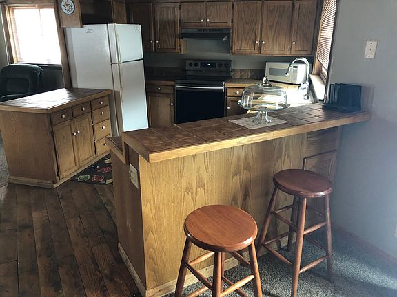 Kitchen with breakfast bar in foreground