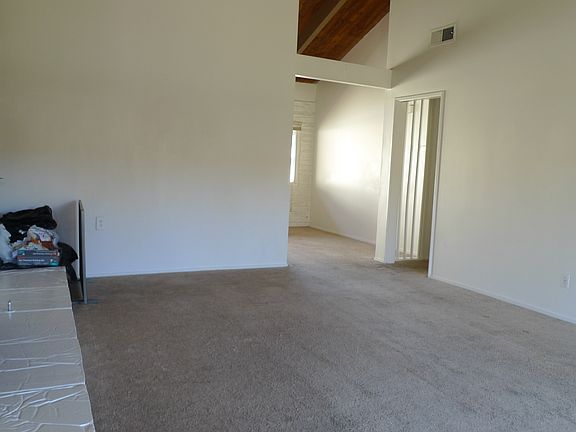 As you enter condo discover a spacious and open living room with high cathedral ceilings and natural light throughout.