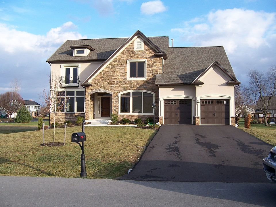 All Stone and Hardboard Stucco Exterior
