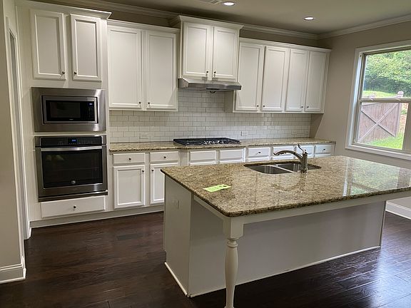 Kitchen with Granite Counter tops, Islands, microwave/Oven, lots of cabinets