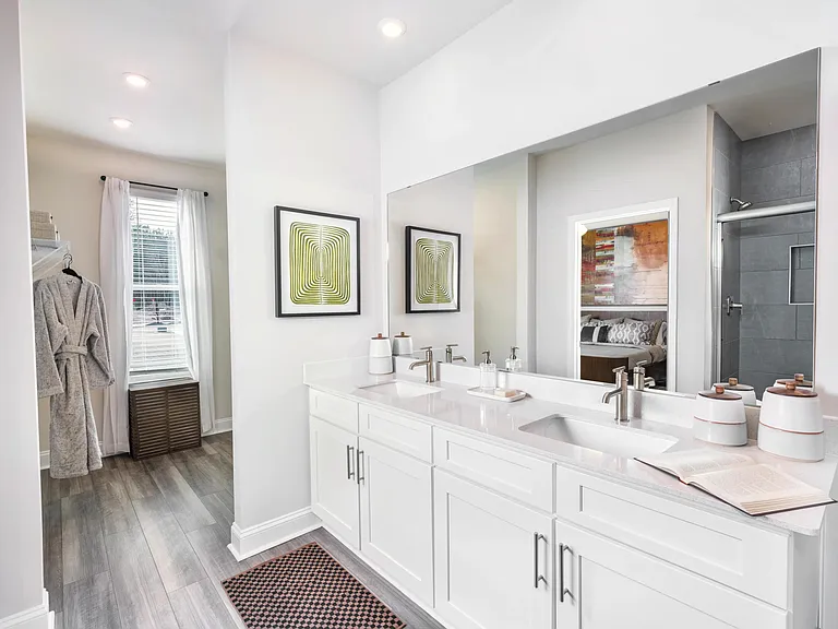 Designer bathrooms feature double vanities, quartz countertops, and large mirrors, all crafted for your ultimate relaxation and style at Amavi Brier Creek. Add to Discover Amenities: Designer bathrooms with double vanities, quartz countertops, and large m