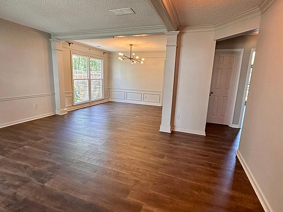 Entry foyer. View here is the foyer, formal living area to the left and formal dining to the far left. Straight ahead visible closed door is the half bathroom.