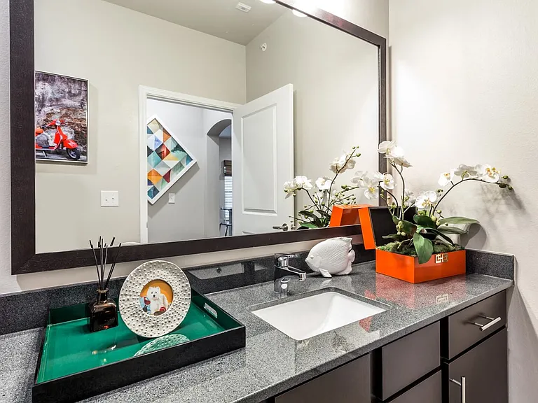 Bathroom with Large Mirror and One Sink