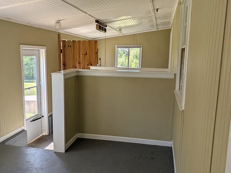 Sunroom and back door, steps to basement