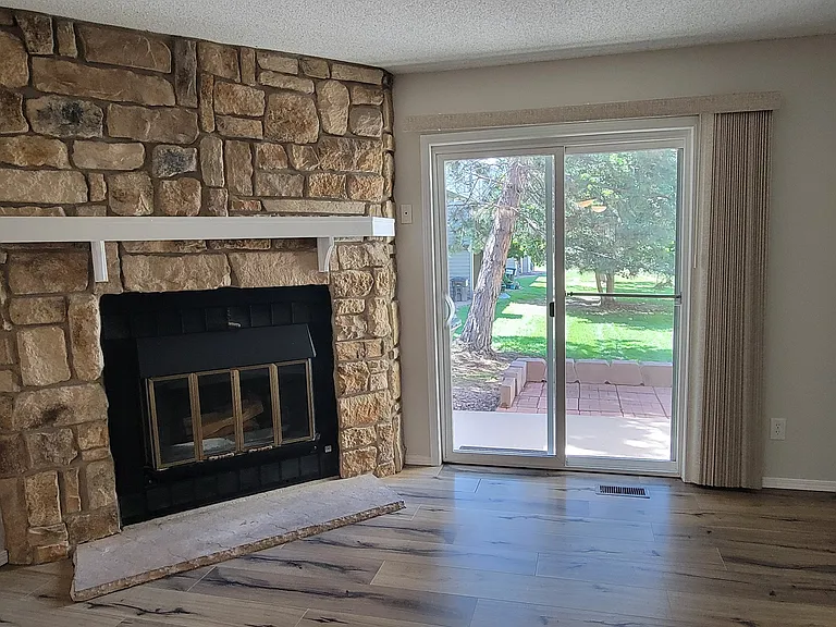 Wood burning fire place. Looking out on the courtyard.