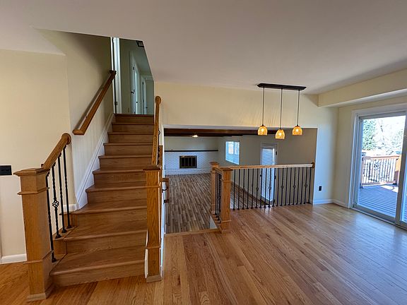 Stairs up to bedroom and down to family room