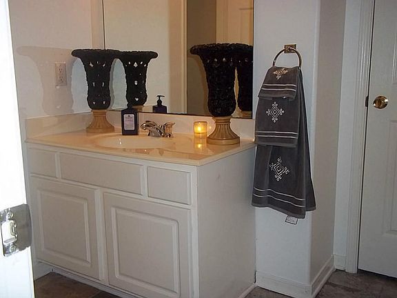 1/2 BATH WITH WALKIN CLOSET,PLUMBED FOR A SHOWER TO MAKE 3 FULL BATHS
