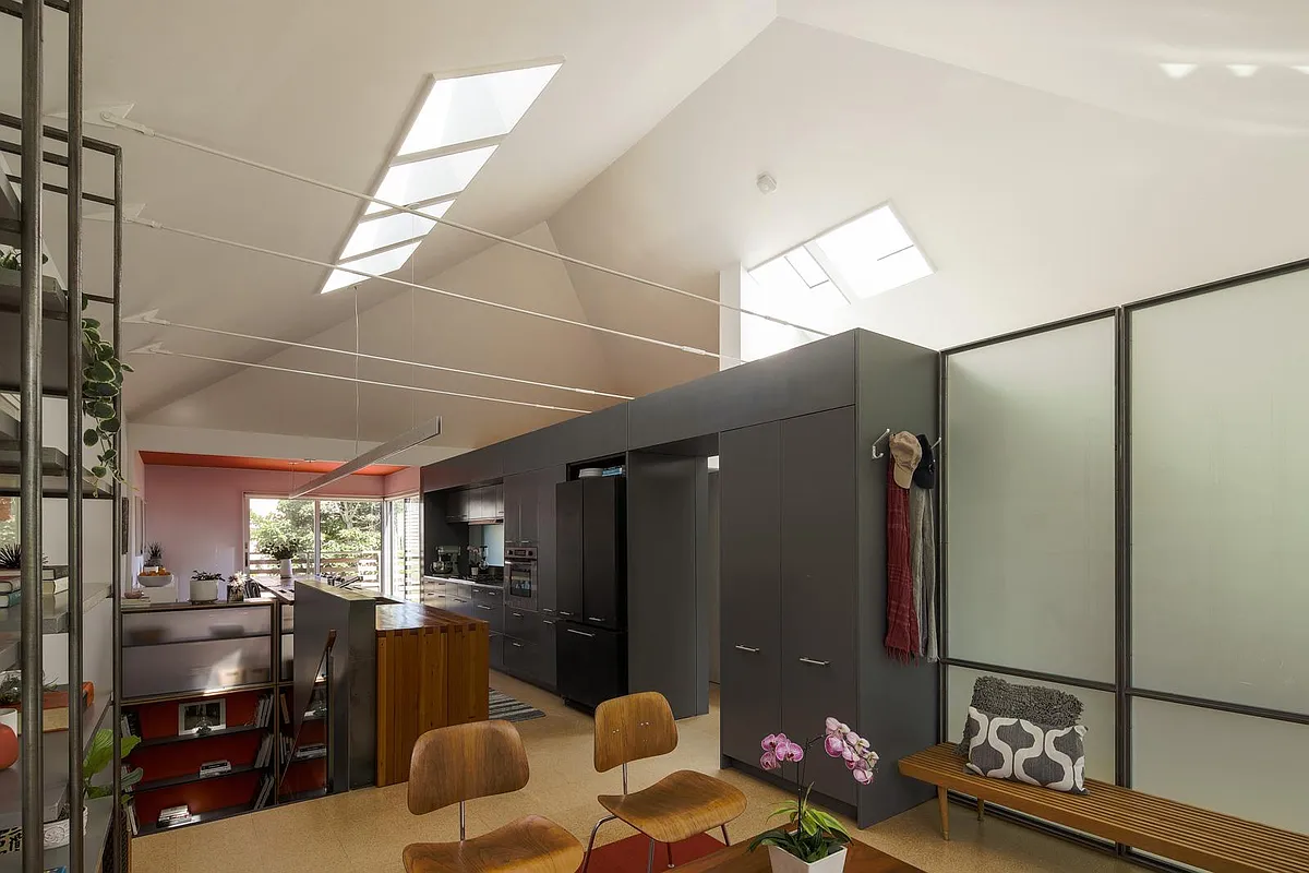 Directly accessed from the front door, the Living Room includes a coat closet, is separated from the second bedroom with an adaptable glass partition, and is open to the kitchen. Skylights above. - 319 Gates St