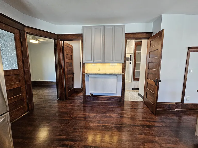 Kitchen connects to back bedroom, pantry, and bathroom.