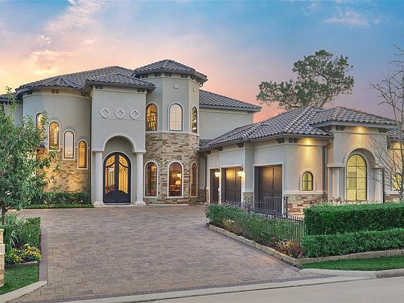 Artfully designed home features 2x6 exterior framed walls for superior energy efficiency, a tile roof, paver detailed driveway, high end landscape lighting, full irrigation system, and a fenced area in the front and side of the home.