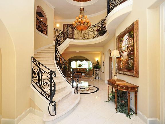 Entry features study to the right and formal dining to the left