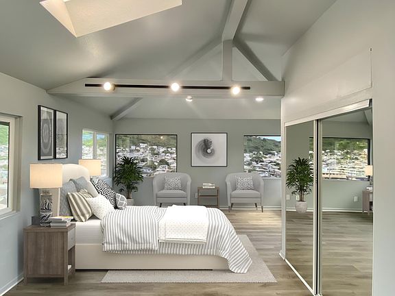Oversized Master bedroom with vaulted ceilings, ocean, diamond head, city and valley views. New Vinyl Plank flooring, paint and large closet with organizer.

Photo has been digitally staged using AI.