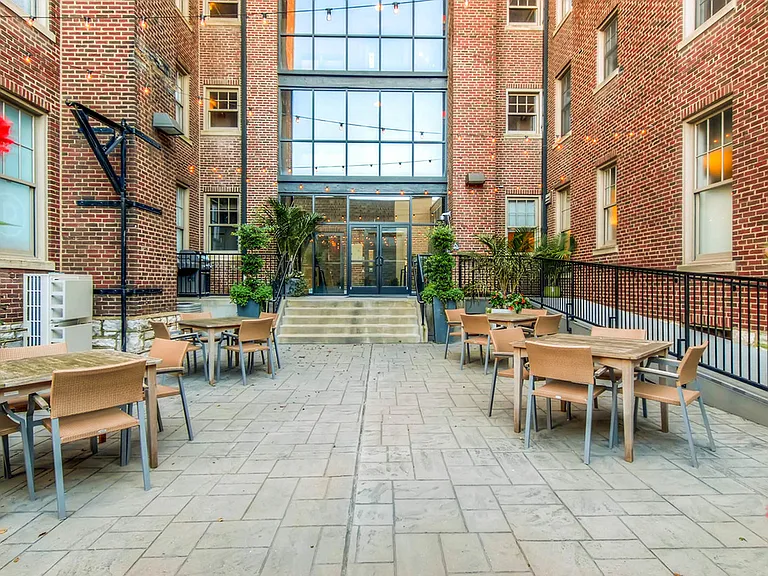 York House quaint courtyard with communal seating and grilling station