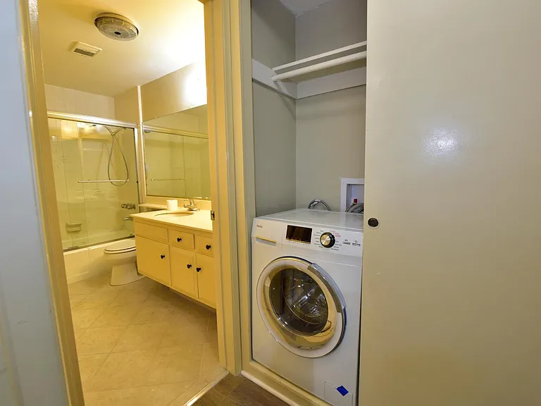 Large updated bathroom with all-in-one laundry machine