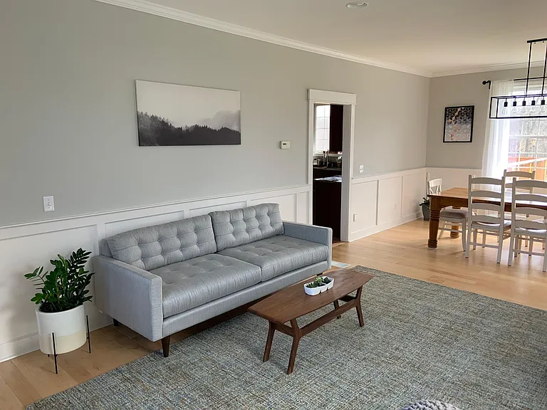 Furnished formal sitting area and dining room.