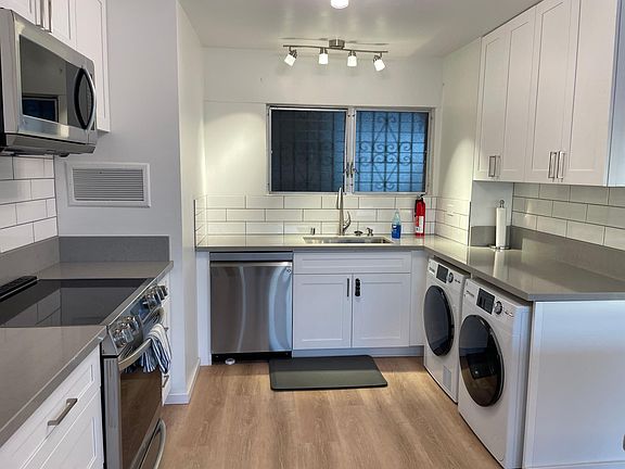 Newly renovated kitchen with brand-new appliances and lights