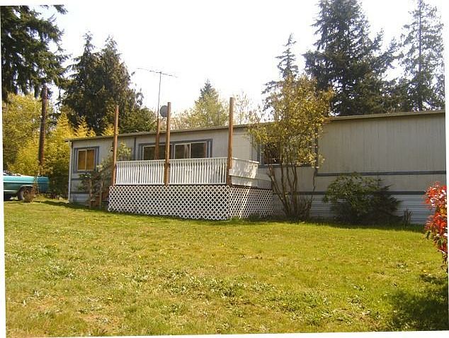 Front of home sits on a large lot