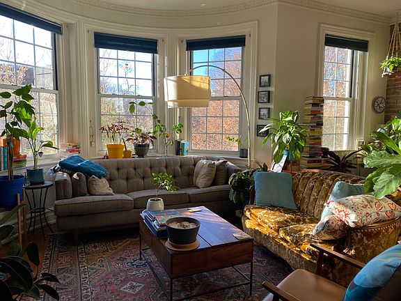Living/dining w/ southern exposure and fireplace