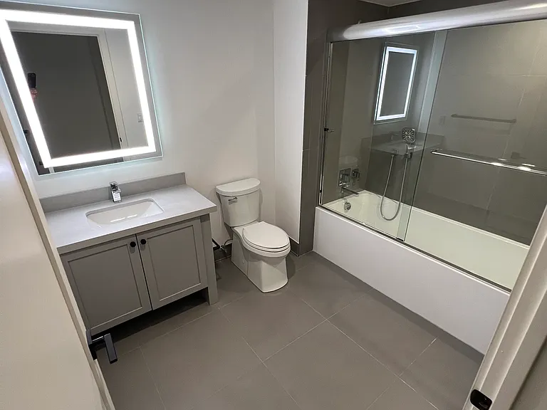 Bathrooms with custom vanities and lighting