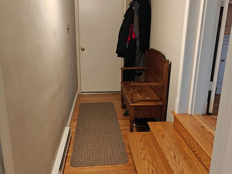 Hallway to mudroom and master bedroom.