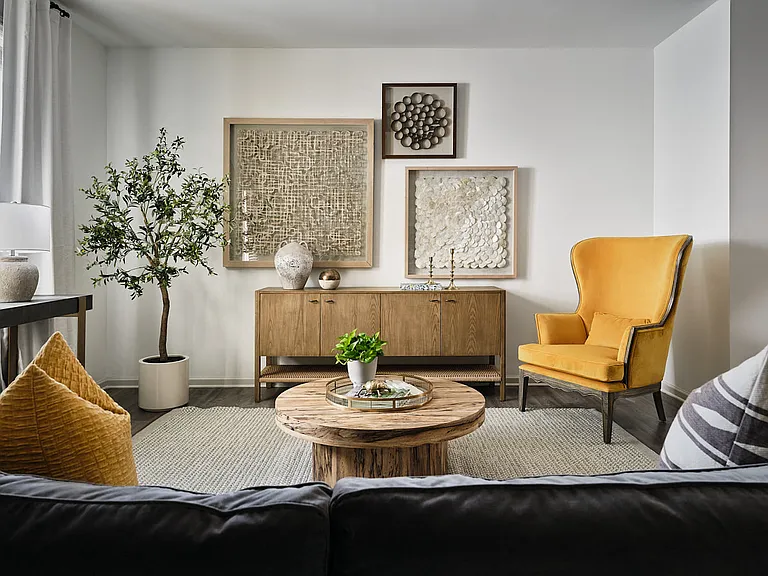 Living room with large window letting in a ton of natural light.