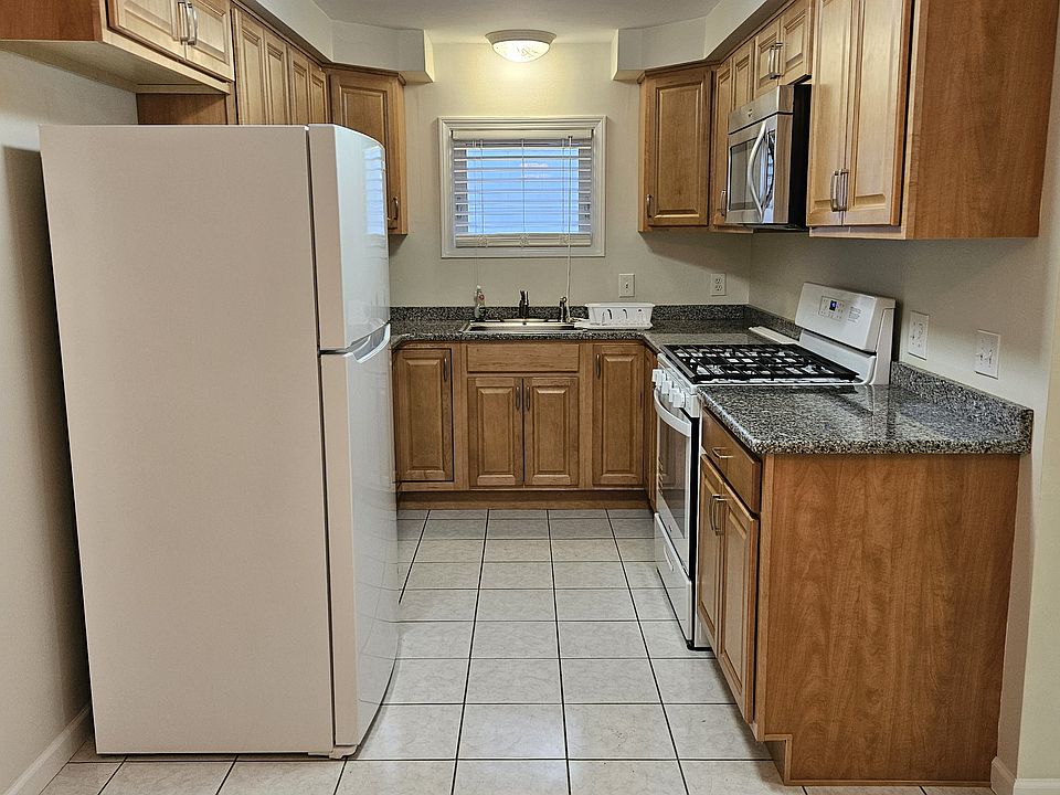 Modern Kitchen with Brand New Stove. and New Refrigerator.