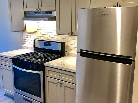 New Stainless Gas Range, Refrigerator, Under LED Lighting, New Cabinets Soft Close, New Countertop, Subway Tile
