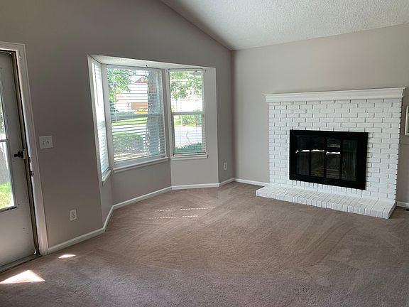 Bay window and wood burning fireplace