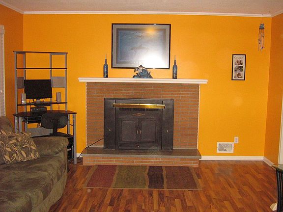 Living Room w/ wood burning fireplace