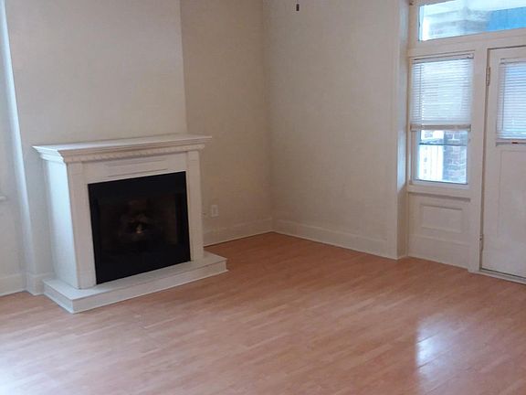 Living room with door to front balcony 