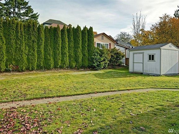 Large back yard with EV charger in driveway (not visible in this older photo).