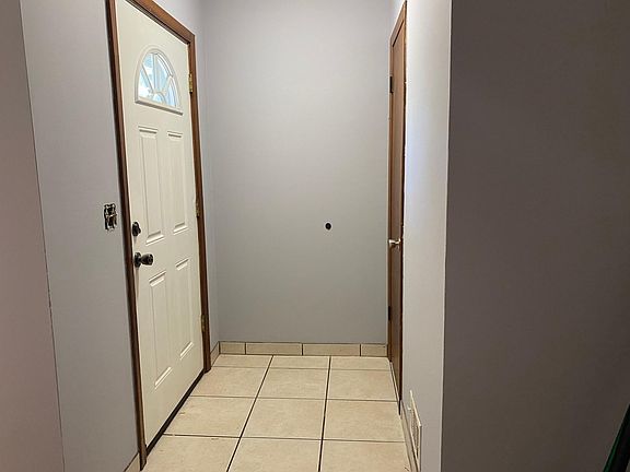One entry way with hall closet and tile floors for easy cleaning. There is another entrance door off the kitchen