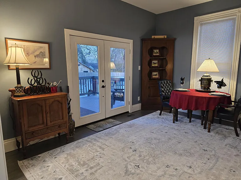 Back entrance, "keeping room" from back deck. Converts to dining room for easy entertaining. Each room can flex to accommodate any function tenant wishes (exercise area, office, play room, reception area, flex bedroom).